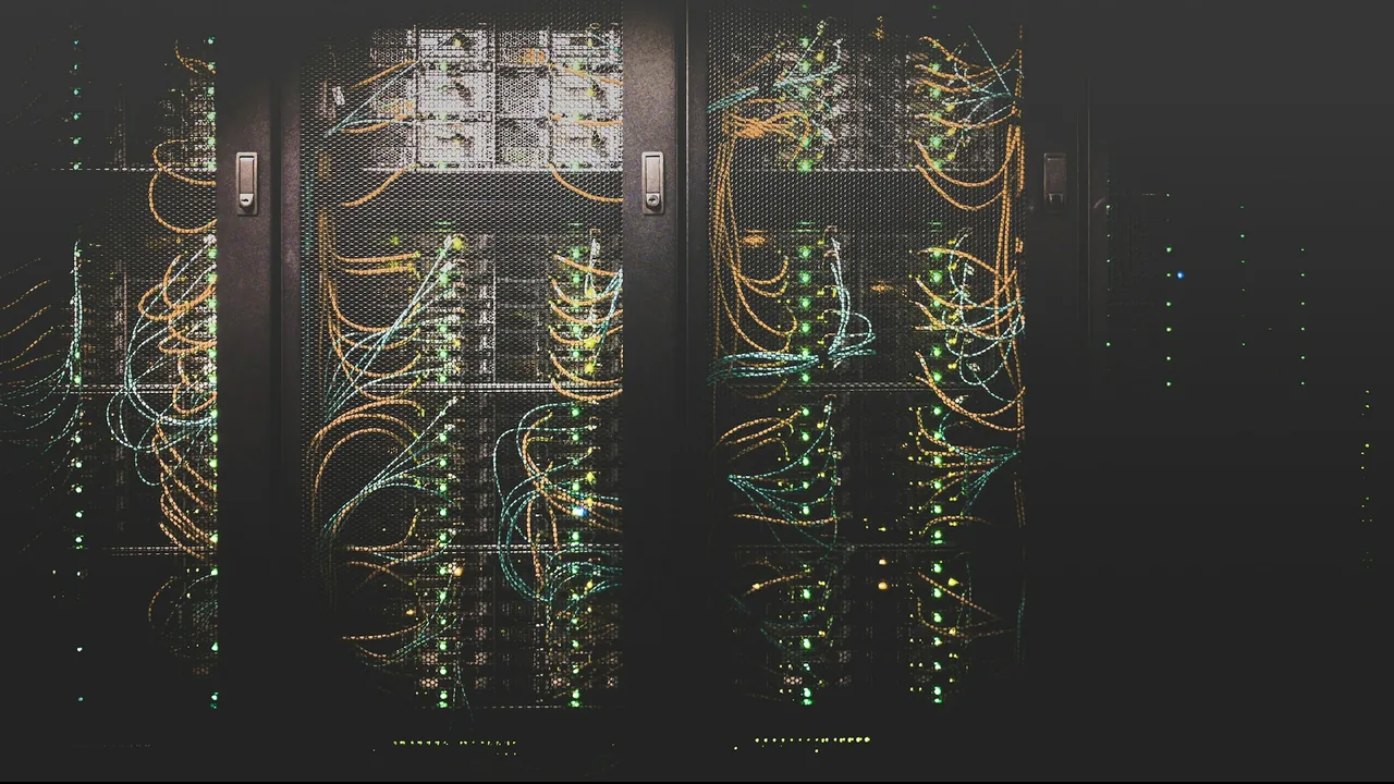 Server racks with patch cables running between them, the hosting half of a care plan